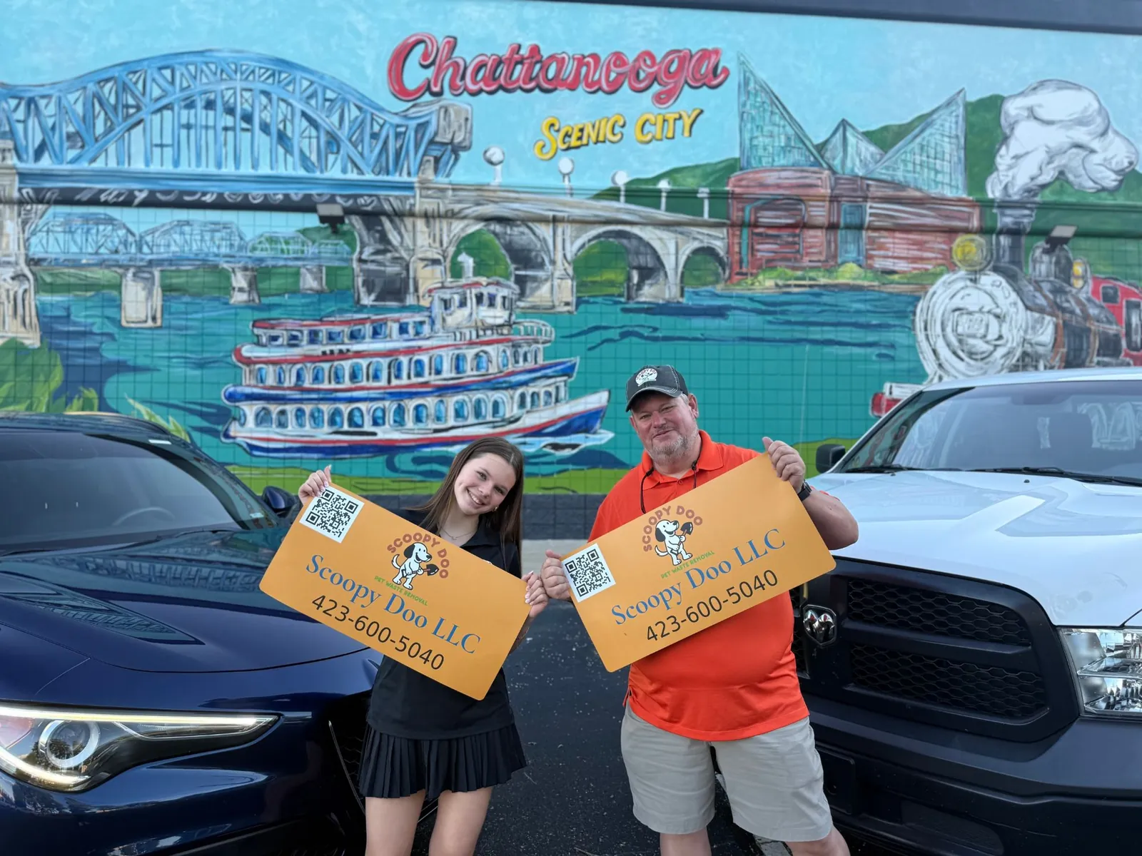 Scoopy Doo LLC, a father-daughter pet waste removal company, at the Chattanooga Scenic City mural